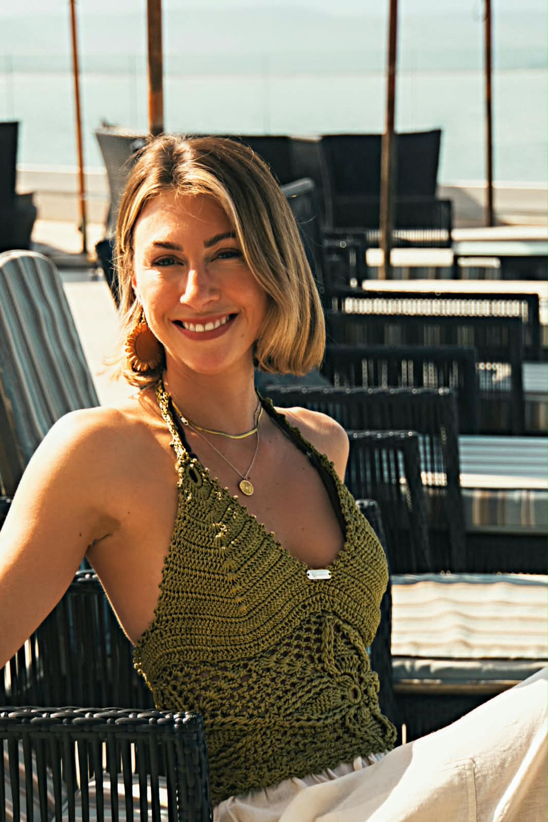 Handcrafted Jade Botanica crochet halter top featuring intricate crochet detailing, a flattering halter neckline, and elegant jade-green tones inspired by tropical botanical landscapes.