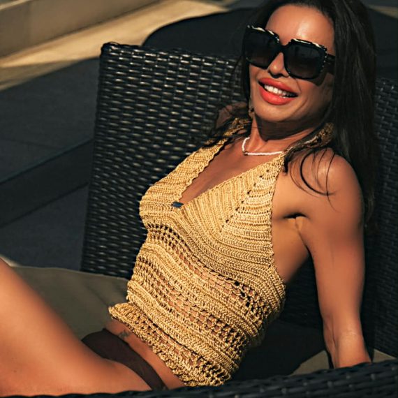 Handcrafted Terracotta Tide crochet halter top featuring intricate crochet detailing, a flattering halter neckline, and warm earthy tones inspired by coastal landscapes.