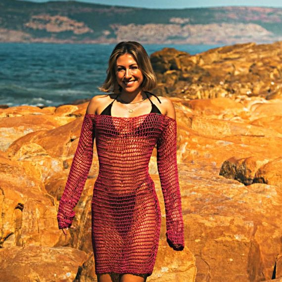Handcrafted Scarlet Tide crochet midi dress featuring intricate crochet detailing, a flattering midi-length silhouette, and vibrant scarlet tones inspired by coastal sunsets and ocean tides.